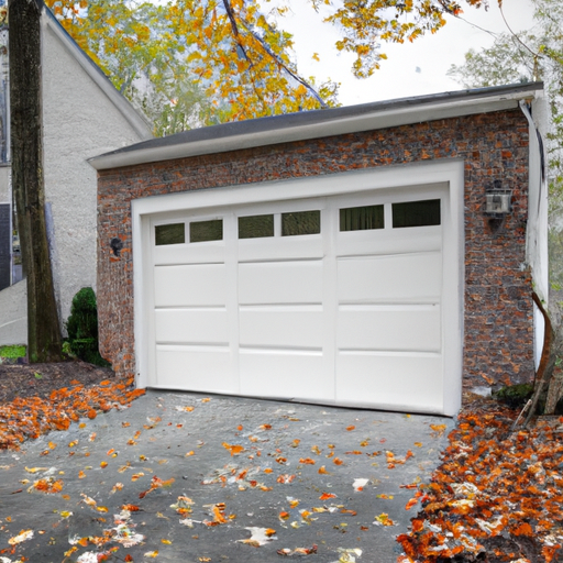Upper Saddle River home with a modern sectional garage door, brick trim and wet driveway with autumn leaves in daylight.