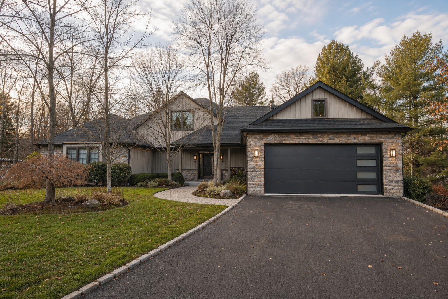 Suburban home exterior with a fully visible garage door in Upper Saddle River, NJ